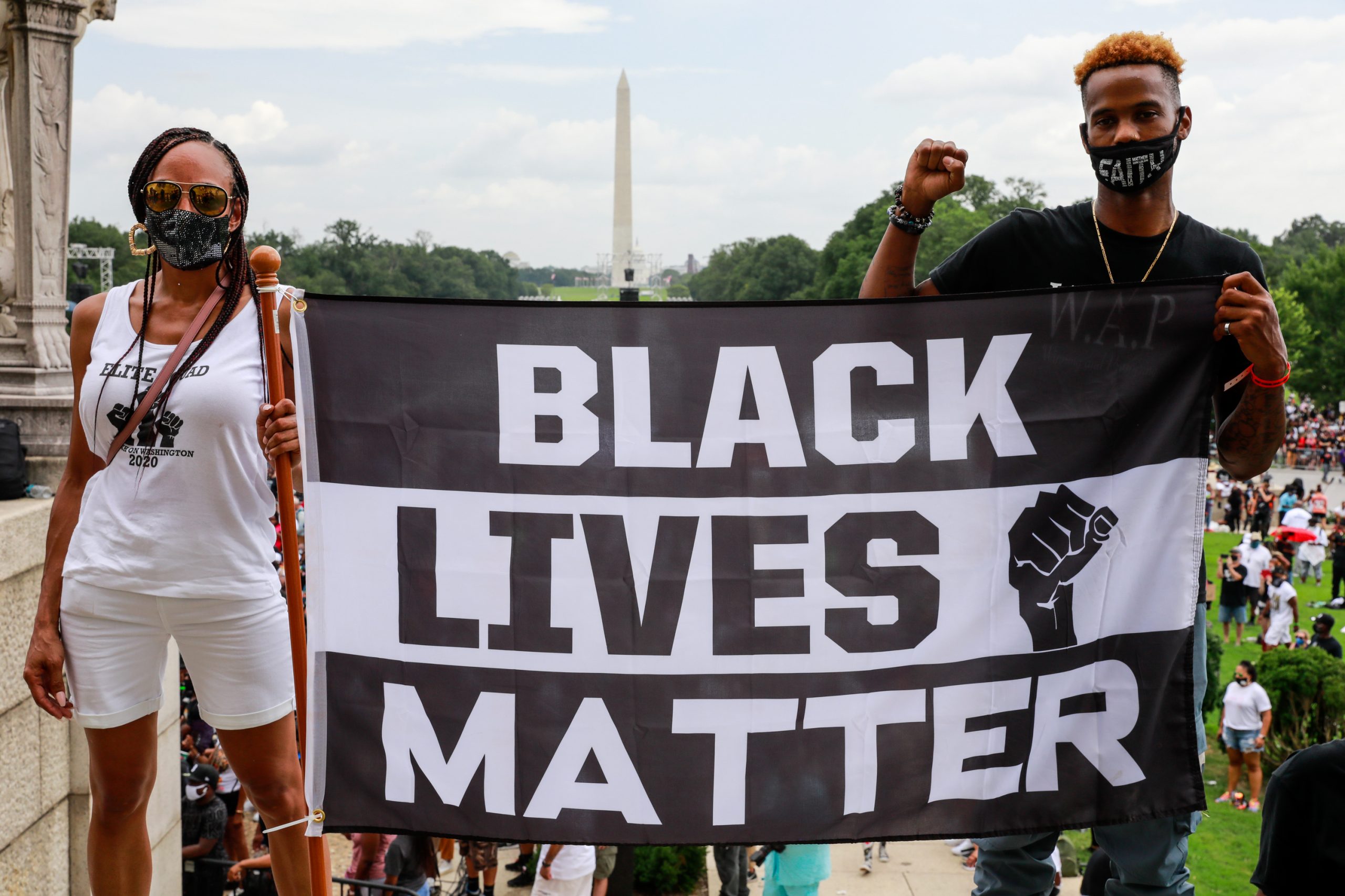 March On Washington To Protest Police Brutality Protesters hold a Black Lives Matter banner during an August 2020 march in Washington D.C.
